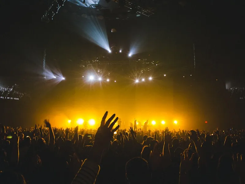 Empty concert stage glowing with dramatic spotlights before a show