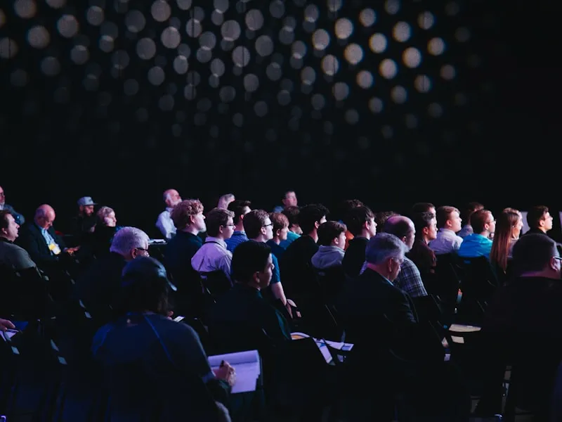 Attentive audience seated at a professional corporate conference
